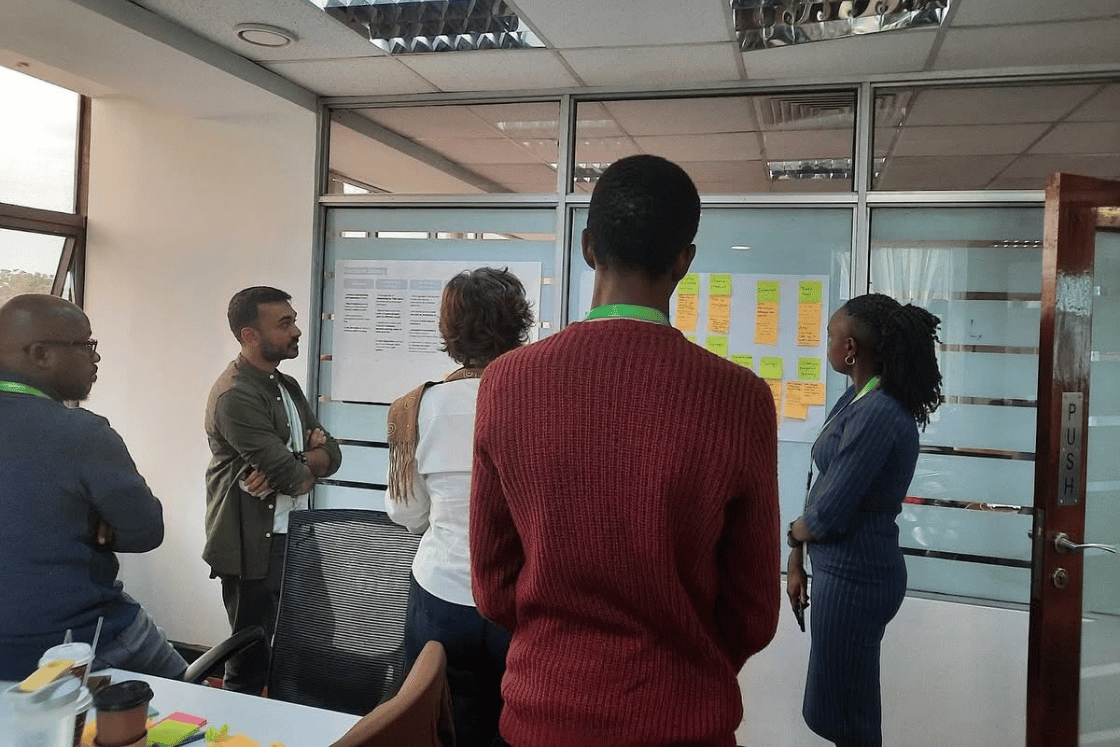YUX, GSMA and Safaricom teams working together during the design and product iteration workshop to translate field research insights into priority opportunity areas and potential product concepts.
